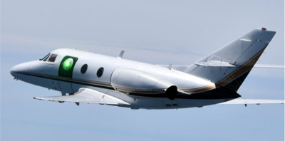 Test aircraft carries HARDROC beam director illuminated by a low-power laser.