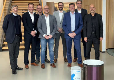 Representatives of Heliatek and Triflex entering partnership.