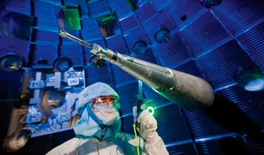 An NIF technician checks the target positioner