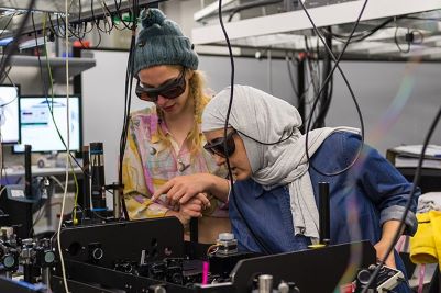 Doctoral students working in Manchester's Photon Science Institute lab.