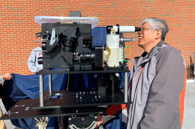 Engineer Jeffrey Chen tests a CASALS lidar prototype.