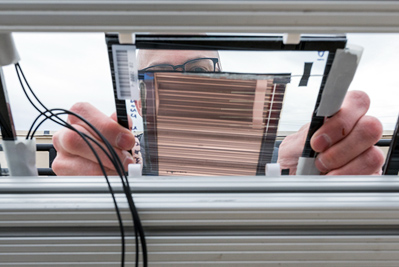 Installing a PACT minimodule at the Outdoor Test Facility at NREL.