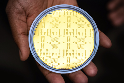 Experimental lasers and amplifiers on a 3in, gold-electroplated silicon wafer.